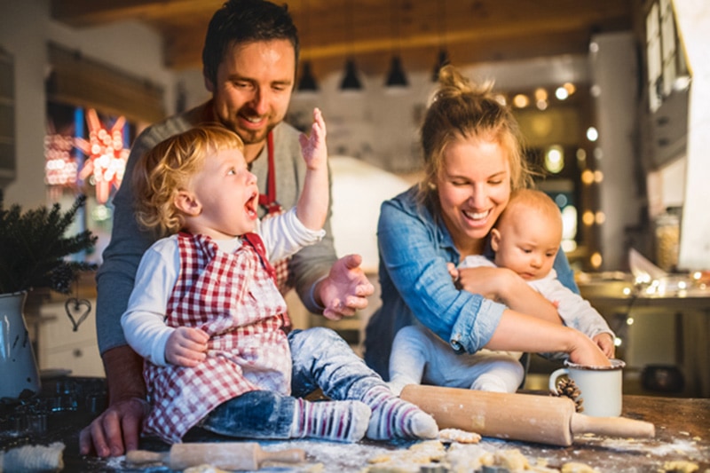 Happy family baking together. 6 Ways Your Furnace Keeps You Safe.