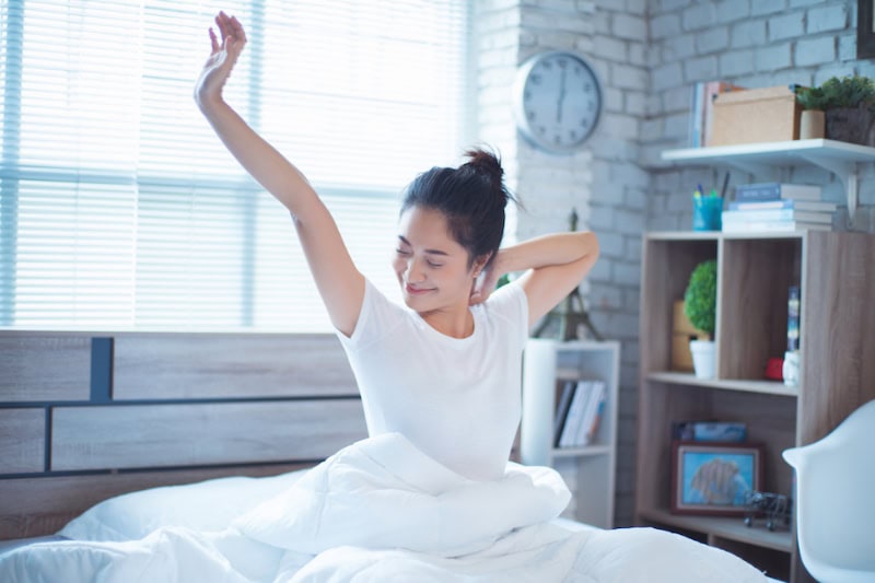 How Your HVAC System Can Help You Sleep. Asian women She is in bed and was waking up in the morning. She felt very refreshed.